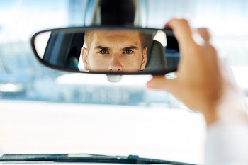 Driver Looking In Rearview Mirror